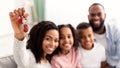 Happy African American family showing keys of their new apartment Royalty Free Stock Photo