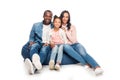 happy african american family sitting on bean bag chair and smiling at camera Royalty Free Stock Photo