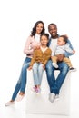 happy african american family sitting together and smiling at camera Royalty Free Stock Photo