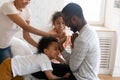 Happy african american family tickle children and having good time. Royalty Free Stock Photo