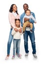 happy african american family with two kids standing together and smiling at camera Royalty Free Stock Photo