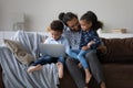 Happy African American family using computer at home. Royalty Free Stock Photo