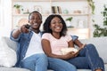Happy african family watching movie together at home Royalty Free Stock Photo