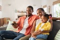 Happy african american family watching TV at home Royalty Free Stock Photo