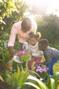 Happy african american father and daughter spending time together outside and planting Royalty Free Stock Photo