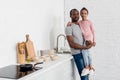 happy african american father holding his daughter at kitchen and looking Royalty Free Stock Photo