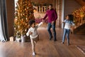 Happy African American father with kids dancing, celebrating Christmas together Royalty Free Stock Photo