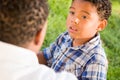 Happy African American Father and Mixed Race Son Talking At The Park Royalty Free Stock Photo