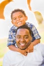 Happy African American Father and Mixed Race Son Playing At The Park Royalty Free Stock Photo