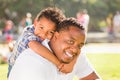 Happy African American Father and Mixed Race Son Hugging At The Park Royalty Free Stock Photo
