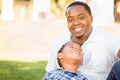 Happy African American Father and Mixed Race Son Relaxing At The Park Royalty Free Stock Photo