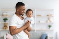Happy African American Father Posing With Infant Baby At Home Royalty Free Stock Photo