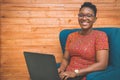 Happy African-American Lady working with laptop at home Royalty Free Stock Photo