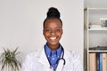 Happy african american female doctor looking at camera, head shot portrait. Royalty Free Stock Photo