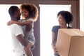 Happy African American female enter new house together Royalty Free Stock Photo