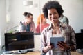 Happy african american female leader holding negotiations meeting with friendly diverse colleague Royalty Free Stock Photo