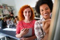 Happy african american female leader holding negotiations meeting with friendly diverse colleague Royalty Free Stock Photo