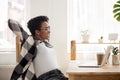Happy black girl relax in chair satisfied with work finished Royalty Free Stock Photo
