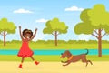 Happy African American Girl Playing with her Dog in Urban Park, Kid Having Fun with Pet Animal on Summer Landscape Royalty Free Stock Photo