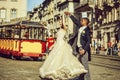 Happy african American groom and cute bride dancing on street Royalty Free Stock Photo