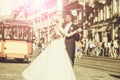 Happy african American groom and cute bride dancing on street Royalty Free Stock Photo