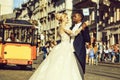 Happy african American groom and cute bride dancing on street Royalty Free Stock Photo