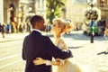 Happy african American groom and cute bride dancing on street Royalty Free Stock Photo