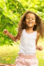 Happy african american kid outdoor, girl blowing bubbles, child playing, having fun,happy childhood, happiness, summer sun Royalty Free Stock Photo