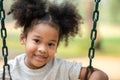 Happy African American little girl smiling look at camera at playground in the park Royalty Free Stock Photo