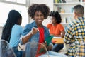 Happy african american male college student at desk at classroom Royalty Free Stock Photo