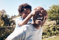 a happy african american man bonding with his young little boy outside. Two black male father and son looking happy and Royalty Free Stock Photo