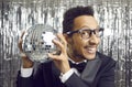 Happy African American man entertainer with disco ball Royalty Free Stock Photo