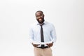 Happy African American man holding documaent paper over isolated white background with a surprise and shock face