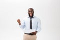 Happy African American man holding documaent paper over isolated white background with a surprise and shock face