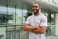 Happy african american man smiling outdoor. Portrait of young happy man on street in city. Cheerful joyful handsome Royalty Free Stock Photo