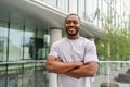 Happy african american man smiling outdoor. Portrait of young happy man on street in city. Cheerful joyful handsome Royalty Free Stock Photo
