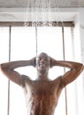 Happy African American Man Taking Morning Shower Indoor, Vertical Shot