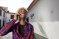 Happy african american man talking on mobile phone outdoors in city Royalty Free Stock Photo