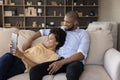Happy African American married couple watching media content Royalty Free Stock Photo