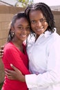 Happy African American mother and her daugher.