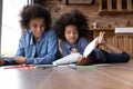 Happy African American mother with little daughter drawing together Royalty Free Stock Photo