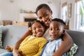 Happy african american mother with little son and smiling daughter Royalty Free Stock Photo