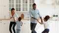 Happy African American parents and two kids dancing to music Royalty Free Stock Photo