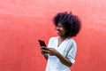 Happy African American with phone in hand