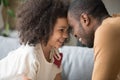 Happy African American preschool daughter and father touching foreheads Royalty Free Stock Photo