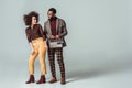 happy african american retro styled couple looking at each other with vintage radio Royalty Free Stock Photo