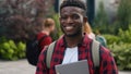 Happy African American student guy man male schoolboy in city outdoors university college campus smiling to camera smile Royalty Free Stock Photo