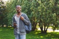 Happy african-american student texting in university campus Royalty Free Stock Photo