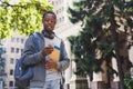 Happy african-american student texting in university campus Royalty Free Stock Photo
