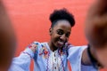 Happy African American takes a selfie, close-up